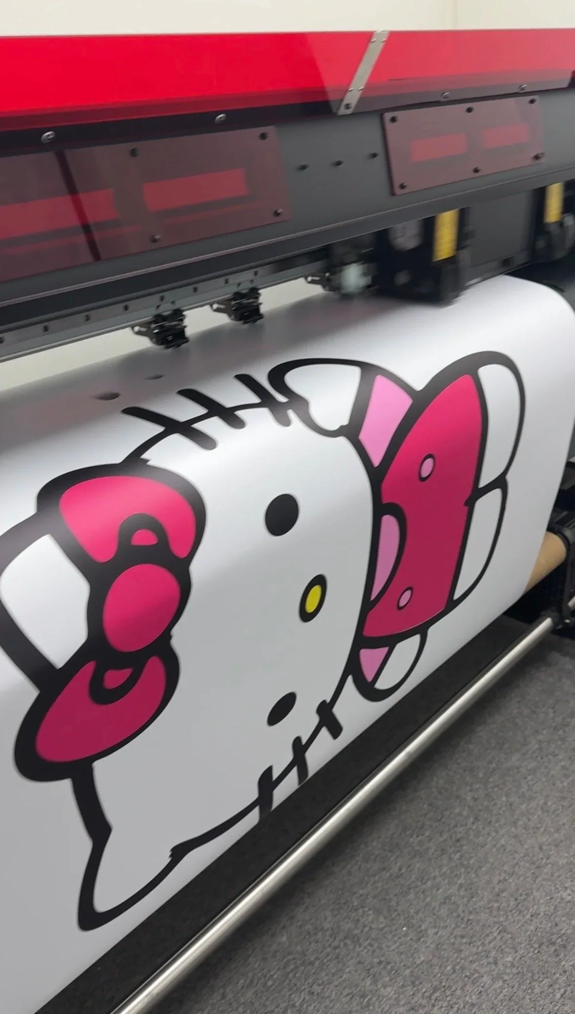 Large vinyl print coming off the printer
