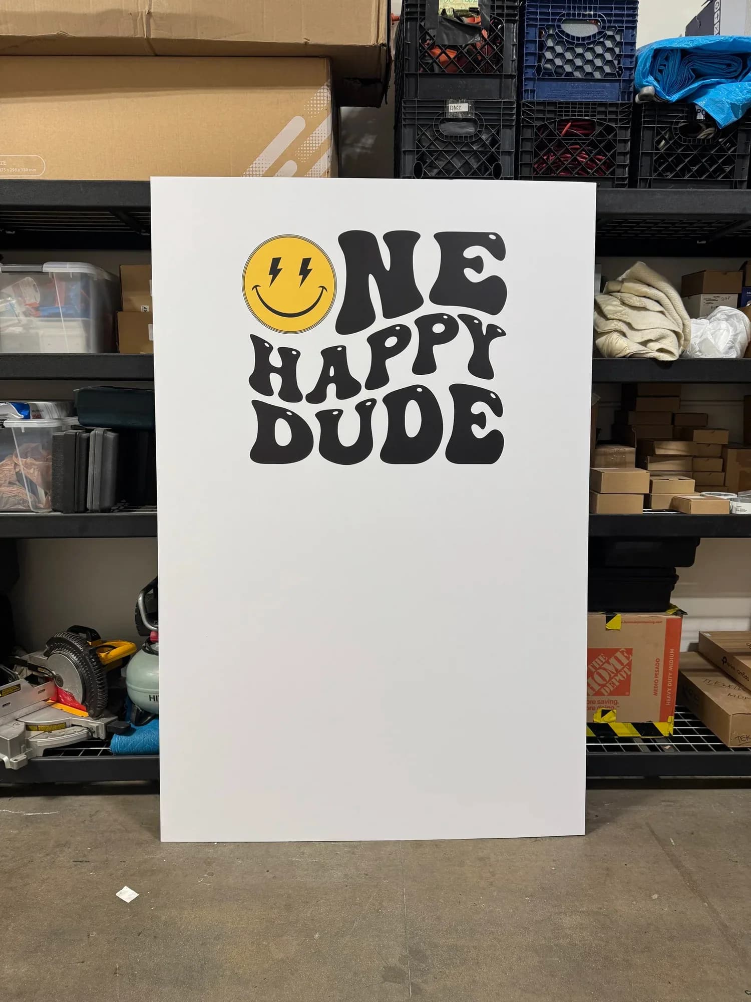 Large printed sign reading One Happy Dude